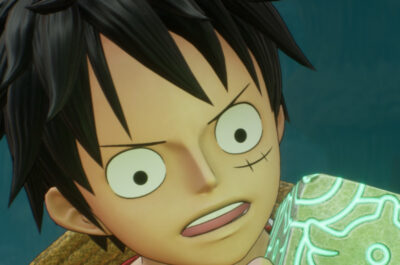 Protagonist Monkey D. Ruffy hält einen Würfel mit leuchtenden Linien in der Hand.